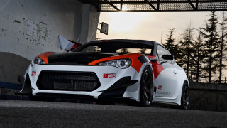White orange sports car garage - the background and a building in the background free wallpaper