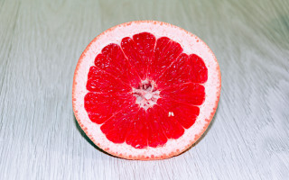 Grapefruit half tabletop white background - a table top free wallpaper