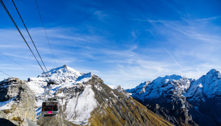 Ski lift mountain sky background - a sky background and a mountain range in the background free wallpaper