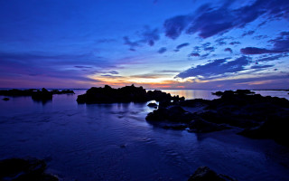 Sunset water rocks clouds beach - the foreground and a sky free wallpaper