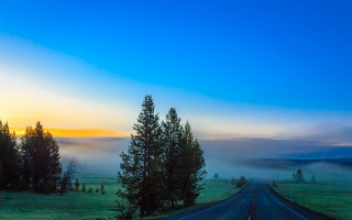 Foggy road trees sky mountains - both side free wallpaper