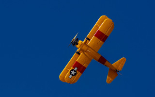 Yellow airplane blue sky propellers - alson s. clark free wallpaper