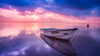 Sunset boat water mountain horizon - rich moody colour free wallpaper