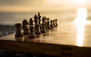Chess board sunshine people blurry - a chess board free wallpaper