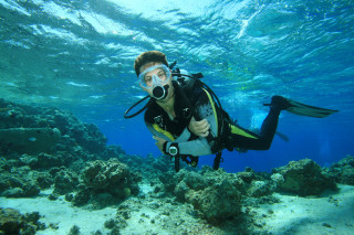 Man diving suit camera looking - the water free wallpaper