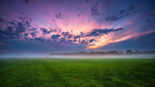 Mystical cloudy sky green field - a sky free wallpaper