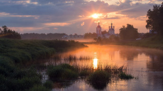 River church sunset foggy sky - a church in the background free wallpaper