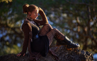 Woman sitting rock brown sweater - neoromanticism free wallpaper