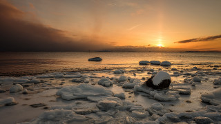 Snowy beach with boats at - ice free wallpaper