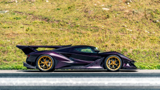 Purple sports car grassy hill - a hill in the background free wallpaper