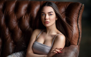 Woman brown couch closed eyes - a brown couch free wallpaper