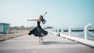 Woman dancing pier black dress - a white fence free wallpaper