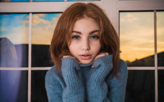 Red haired woman blue sweater - a picture in front free wallpaper for desktop