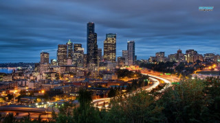 City skyline highway freeway night - a cloudy sky above free wallpaper