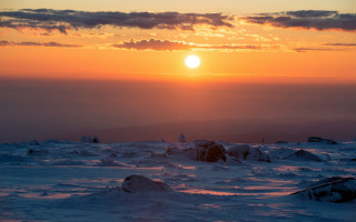 Sunset snowy mountain skier distant - a sunset over a snowy mountain free wallpaper