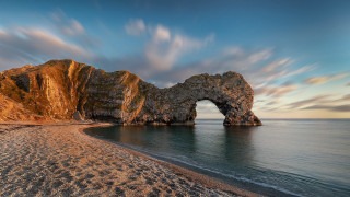 Rock formation beach sky water - sandy free wallpaper