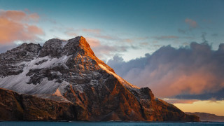Mountain snow peak ocean sunset - a sunset in the background free wallpaper