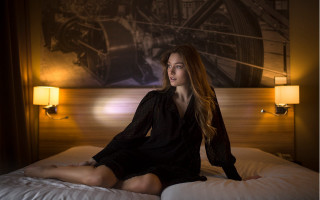 Woman sitting bed american barbizon - a lamp free wallpaper