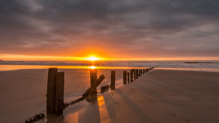 Sunset beach wooden fence dusk - crepuscular ray free wallpaper