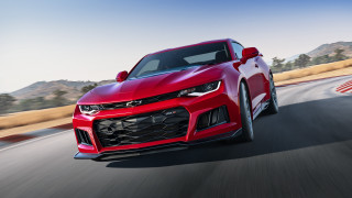 Red chevrolet camaro mountains road - a blue sky in the background free wallpaper for desktop