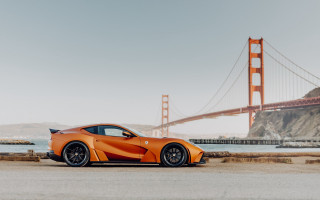 Orange sports car bridge water - a bridge and a body of water free wallpaper