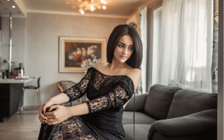 Woman black dress couch livingroom - a couch in a living room free wallpaper