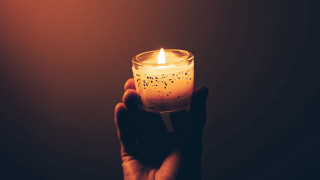 Candle lit symbolism person holding - a person holding free wallpaper
