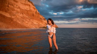 Woman bikini cliff water sunset - evaline ness free wallpaper