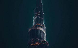 Tall building lit night sky - architecture free wallpaper
