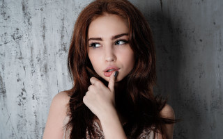 Hush gesture woman graywall blueeyes - a gray wall behind her free wallpaper