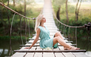 Woman bridge blue dress sky - a bridge in the background free wallpaper