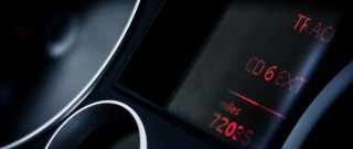 Speedometer red light black background - shallow free wallpaper for desktop