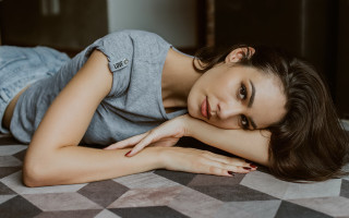 Woman lying bed argyle checkered - private press free wallpaper