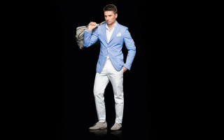 Man bluejacket whitepants holdingjacket camera - a blue jacket free wallpaper