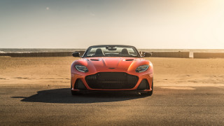 Red sports car beach ocean 6 - a boat in the background free wallpaper