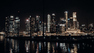 City skyline night boat reflections - the water and buildings free wallpaper
