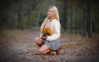 Woman kneeling flowers forest portrait - the ground and trees free wallpaper