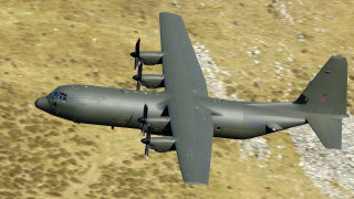 Military plane flying over grass - art free wallpaper