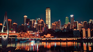 City skyline night bridge river 12 - a bridge and a river in front free wallpaper
