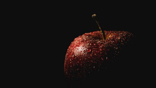 Red apple water droplets dark 2 - a red apple free wallpaper