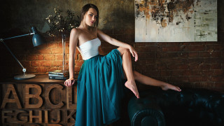 Woman green skirt couch brick - a green skirt free wallpaper