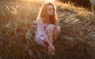 Woman sitting field autumn fireworks - her leg free wallpaper for desktop