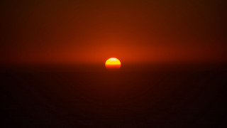 Sunset orange sun black background - a sunset free wallpaper