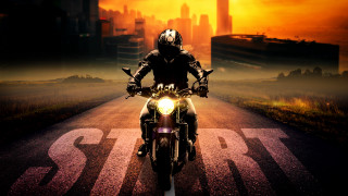 Man motorcycle cityscape orange sky - a yellow light free wallpaper