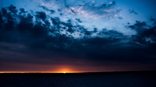 Sunset clouds boat water horizon - sunset free wallpaper