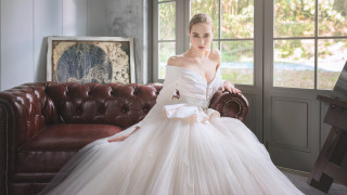 Woman white dress couch window - elegant pose free wallpaper