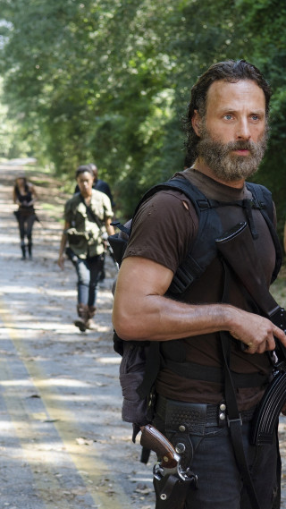 Bearded man gun walking road - a road free wallpaper