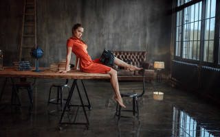 Woman orange dress sitting table - a still life free wallpaper