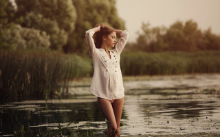 Woman standing water hands on - lake free wallpaper