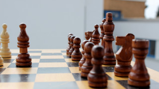 Chessboard pieces building blurry checkered - a window in the background free wallpaper